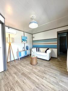 a room with a bed and a couch at Campo Vecchio Mare et Piscine in Ghisonaccia +24 photos