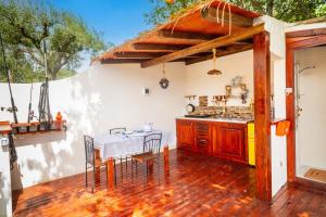 a kitchen and dining room with a table and chairs at Etna's boat house in Piedimonte Etneo
