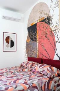 a bedroom with a bed with a large headboard at Domus del Gotha in Mazzarino