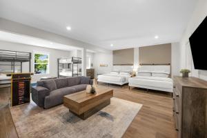a living room with two beds and a couch at Paddle Pointe in Sherrills Ford +40 photos