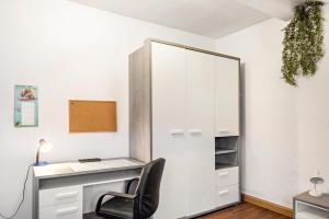 a white desk with a chair next to a mirror at Ferienwohnung Thüringer Wald in Ilmenau +17 photos