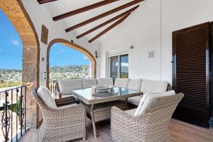 a living room with a table and chairs at Ayora in Jávea
