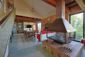 a living room with a fireplace in a house at Bed And Breakfast Sciarammola in Patti