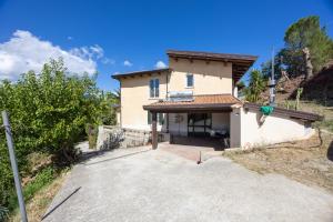 a house with a driveway in front of it at Bed And Breakfast Sciarammola in Patti