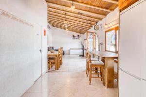 a kitchen and dining room with a table and chairs at Casa Stone in Benissa