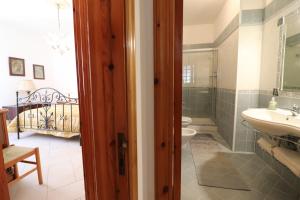 a bathroom with a sink and a toilet at Casa Kefera a Otranto in Otranto +21 photos