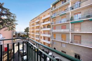 an apartment building with balconies on the side of it at Casa Daniele Vista Mare - Sanremo in Sanremo