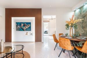 a dining room with a table and chairs at Eldorado Luxury Villa in Afantou