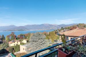 a view of the water from a balcony at L'attico Con Terrazza Vista Lago in Laveno-Mombello