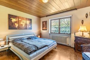 a bedroom with a bed and a wooden ceiling at Hirschturmblick in Zell am Harmersbach