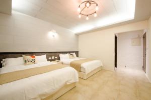 Postel nebo postele na pokoji v ubytování Successful 168 B&B
