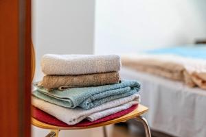 a pile of towels sitting on a table at Ferienwohnung 1 Schulze in Neustrelitz +21 photos
