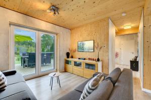 a living room with a couch and a table at Ferienhäuser Stickel in Freudenstadt