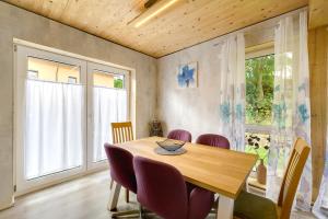 a dining room with a wooden table and chairs at Ferienhäuser Stickel in Freudenstadt
