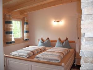 two beds sitting on a bed in a room at Ferienwohnungen Oberbrunnhof in Naturno