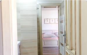 a door leading into a bedroom with a bed at Chalupa Hlohovec in Hlohovec