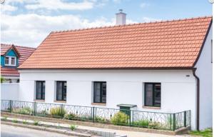a white house with an orange roof at Chalupa Hlohovec in Hlohovec