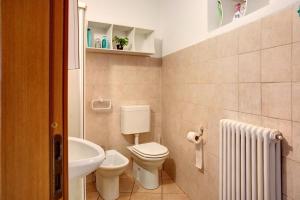 a small bathroom with a toilet and a sink at Foresteria al Cantun in Sondrio +11 photos
