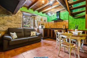 a living room with a couch and a table at Eiron in O Porto de Espasante