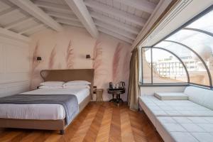 a bedroom with a bed and a window at Hotel The Corner Roma in Rome