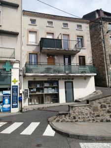 a building with a book store in front of it at La Clef in Saint-Julien-Molin-Molette