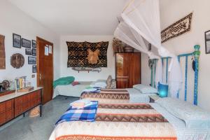 a bedroom with two beds and a dresser at Casa Bice in Marcialla
