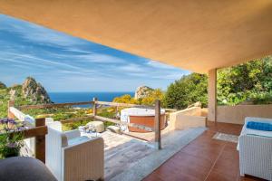 a balcony with a view of the ocean at Villa Aloe in Costa Paradiso