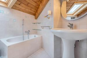 a bathroom with a sink and a bath tub at Alle Rive apartment in Salò +15 photos
