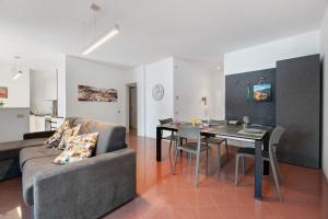 a living room with a couch and a table at Domaso front lake in Domaso