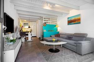 a living room with a couch and a table at Apartment am Wald in Dörentrup