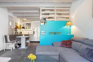 a living room with a couch and a table at Apartment am Wald in Dörentrup