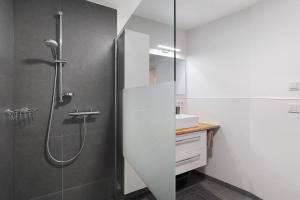 a bathroom with a shower and a sink at Relax Oase in Sasbachwalden +25 photos