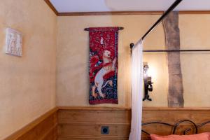 a tapestry hanging on the wall of a bedroom at Daol Grenn in Pluvigner +54 photos