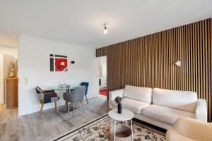a living room with a couch and a table at Sonnenterrasse im Schwarzwald in Freudenstadt +19 photos