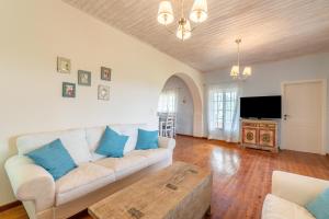 a living room with a couch and a coffee table at Blue apartment Corfu in Perivólion