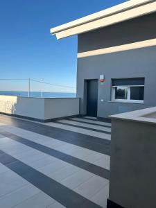 a building with a view of the ocean at Luxury Room in Bari