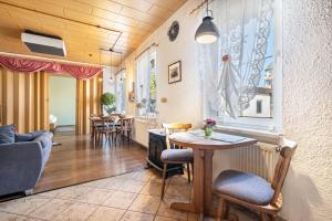 a living room with a table and chairs at Ferienhaus Nestwärme in Calau +17 photos