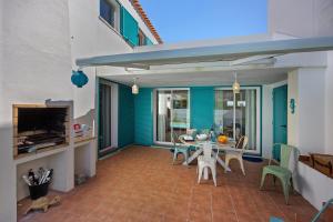 a dining room with a table and chairs at V-Blue in Alvor