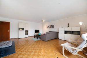 a living room with a couch and a table at Das Spatzennest in Riol