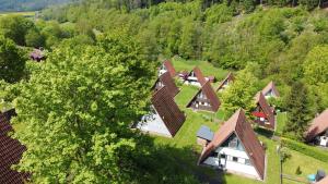 an overhead view of a group of houses in a forest at Ferienhaus Waldperle in Ronshausen +5 photos