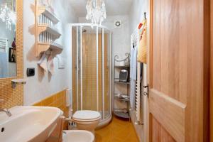 a bathroom with a shower and a toilet and a sink at Casa Gocce Di Cristallo in Varazze +15 photos
