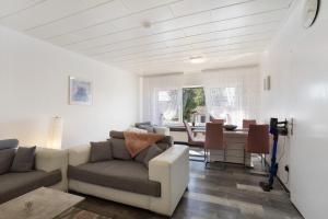 a living room with a couch and a table at Ferienwohnung Cakir in Meinerzhagen