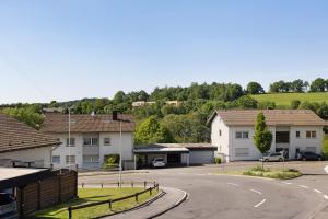 a street in a small town with houses at Ferienwohnung Cakir in Meinerzhagen