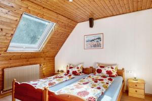 a bedroom with a bed and a window at Haus Antonis in Triberg