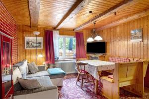 a living room with a couch and a table at Haus Antonis in Triberg