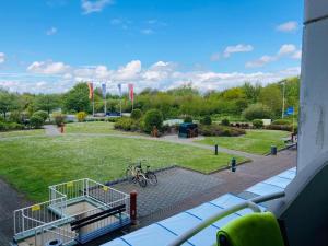 a view of a park from a balcony at 109 im Lord Nelson in Cuxhaven
