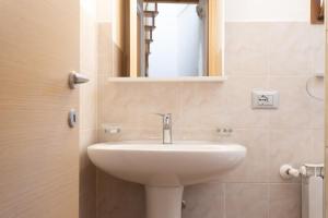 a bathroom with a sink and a mirror at Artù in Tremosine Sul Garda