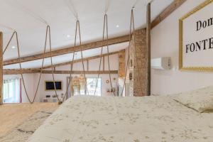 a bedroom with a large bed in a room at Le Loft in Esparron +15 photos