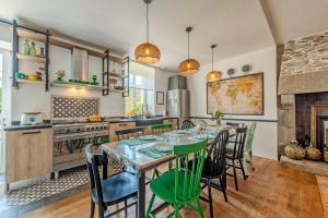 a kitchen with a table and chairs in a room at Maison 8 pers plein centre ville in Lesneven +20 photos