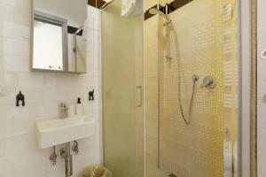a bathroom with a shower and a sink at Casa Merlino in Biassa +21 photos